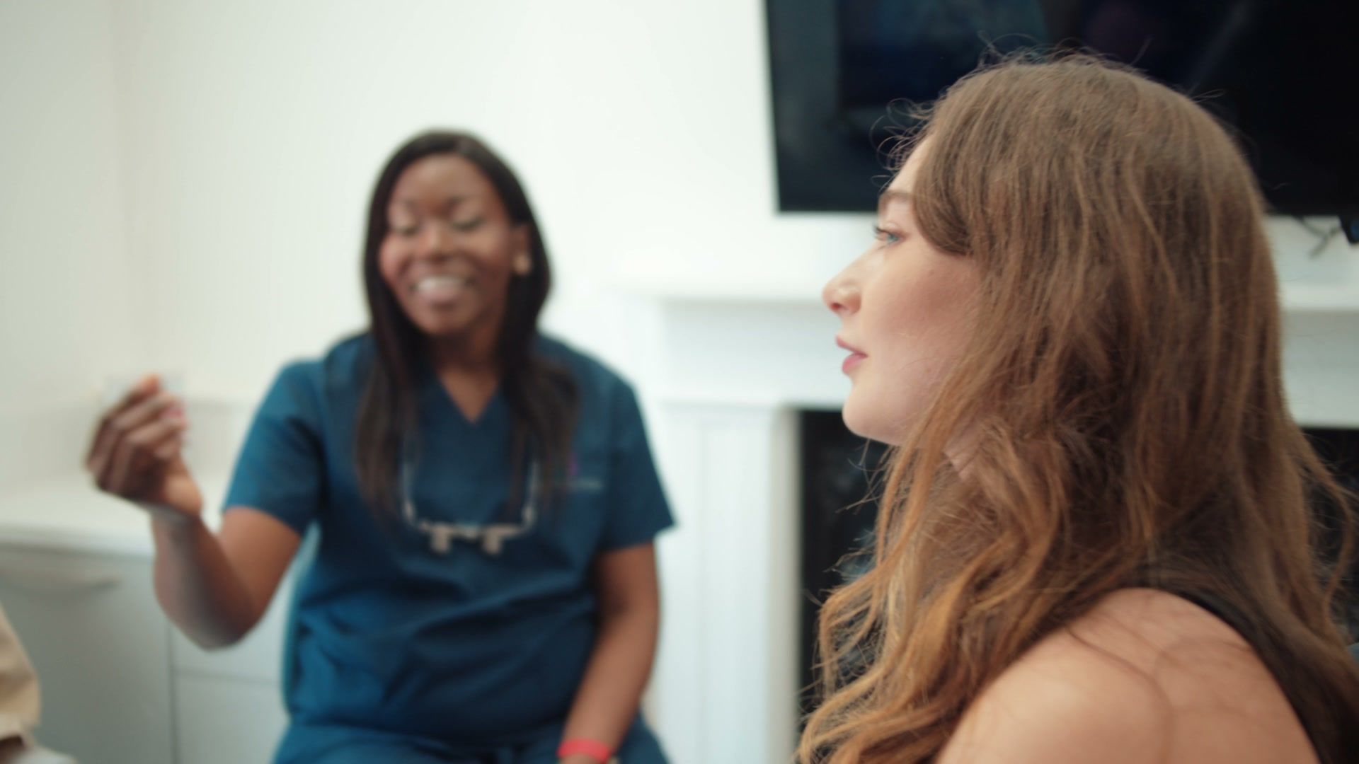 Still from the Dover Priory Dental practice film: Dr Dorothy Riley talking with a patient
